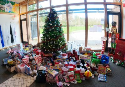 Tree with unwrapped present at parks and rec. building