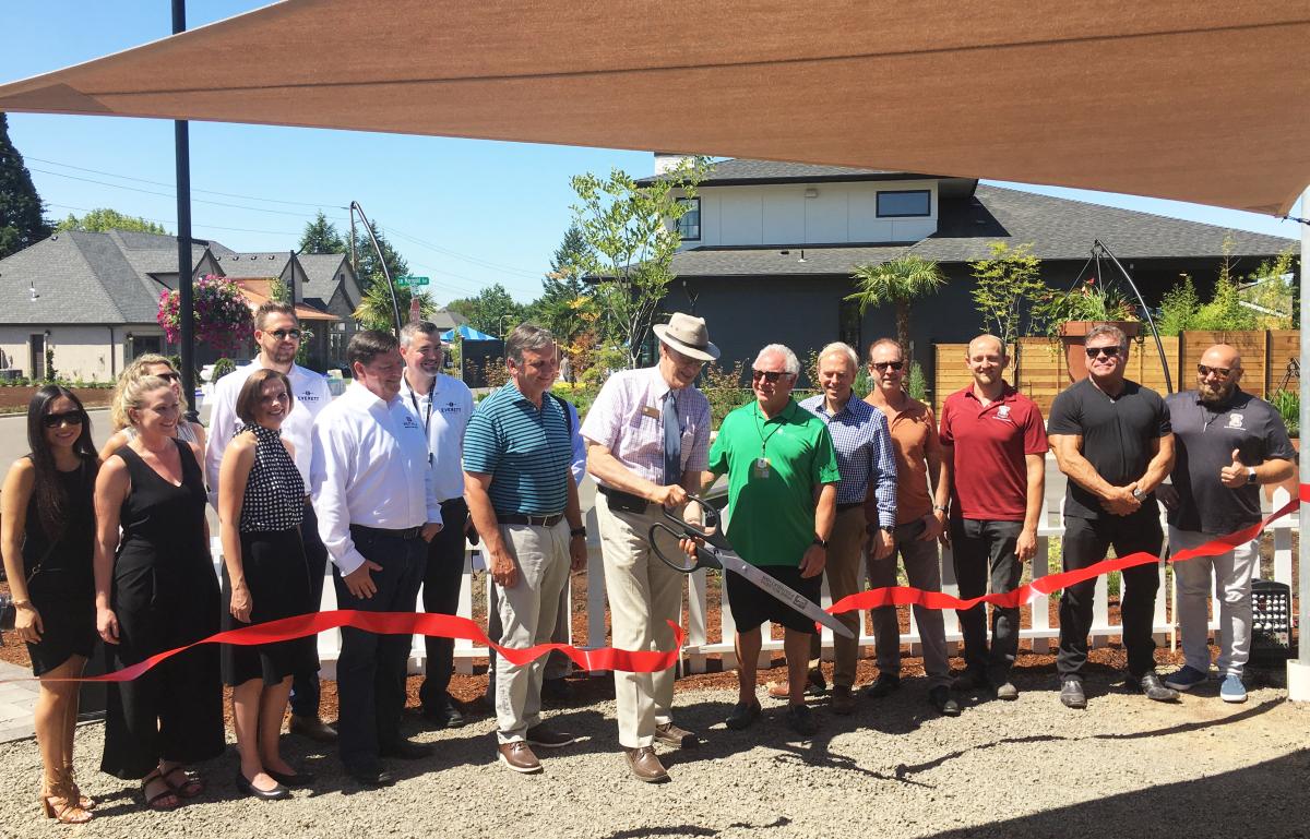 Mayor Knapp officially opens the 2019 Street of Dreams in Wilsonville with a ribbon cutting.