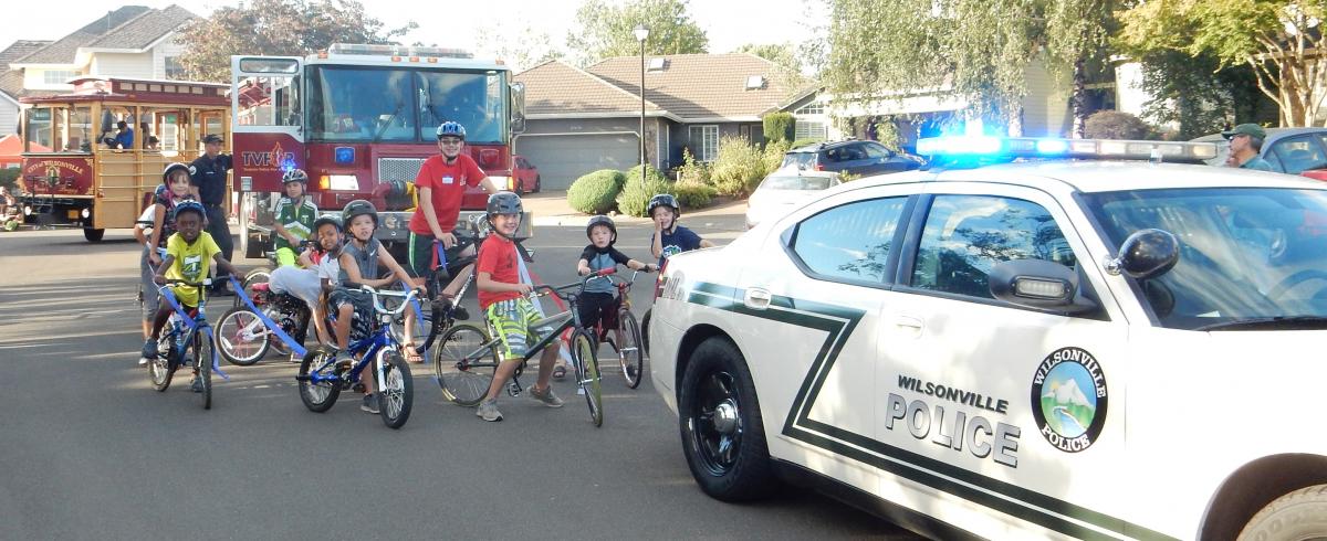 Young cyclists join Wilsonville Police and Tualatin Valley Fire & Rescue on parade route. 